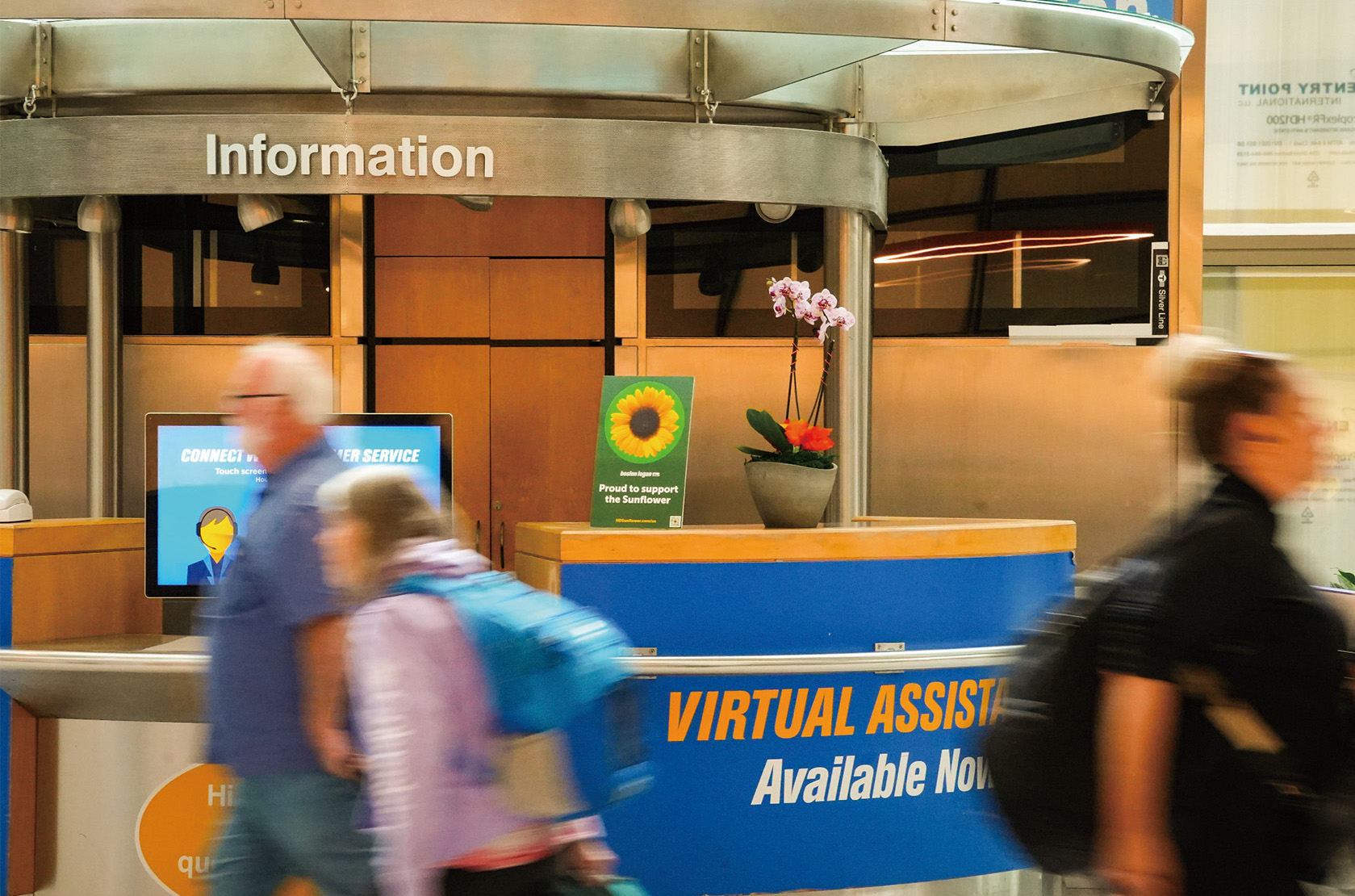 Photo shows the information desk in first floor of Boston logan terminal E